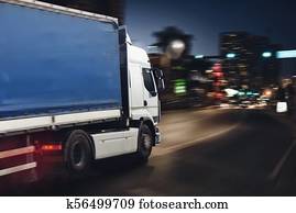 Fast truck on a city road delivering at night Fast truck on a city road delivering at night