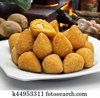 Coxinha de Galinha - Brazilian deep fried chicken snack, popular at local parties. Served with chili sauce.