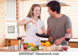 Couple cooking dinner Couple cooking dinner