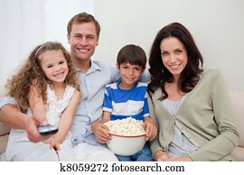 Family watching a movie together Family watching a movie together