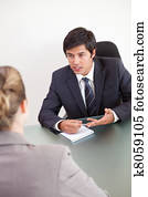 Portrait of a manager interviewing a female applicant