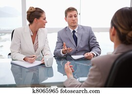 Business partners talking with lawyer Business partners talking with lawyer