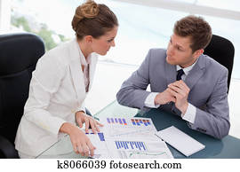 Business team deliberating on market research