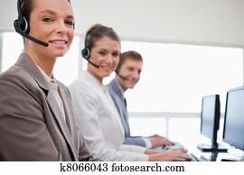 Side view of customer service team