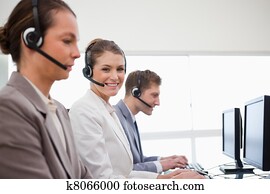 Side view of telephone service office employees
