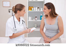 Smiling doctor with patient