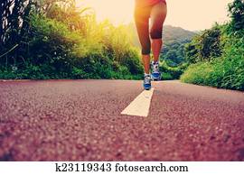 young fitness woman runner legs run