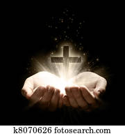 Holding a cross Holding a cross