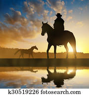 Silhouette cowboy with horse Silhouette cowboy with horse