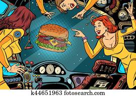 Women astronauts in the cabin of a spaceship and Burger Women astronauts in the cabin of a spaceship and Burger