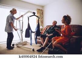 Homecare Workers preparing Hoist Homecare Workers preparing Hoist