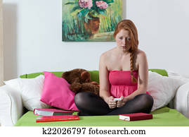 Sad teen expecting baby