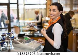 Salesperson at cash register Salesperson at cash register