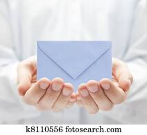 Blue paper envelope in hands Blue paper envelope in hands