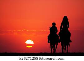 mother and son on horseback mother and son on horseback