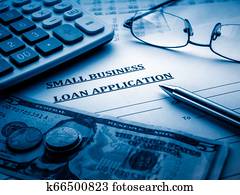 small business loan application on the desk.