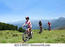 Family riding bikes in the mountains