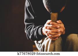 Portrait of a man praying with his eyes closed. Portrait of a man praying with his eyes closed.