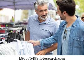 young hipster brothers at weekly cloth flea market young hipster brothers at weekly cloth flea market