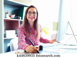 Graphic designer drawing something on graphic tablet Graphic designer drawing something on graphic tablet