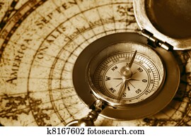 old compass on vintage map old compass on vintage map