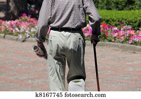 Portrait of senior man walking in park
