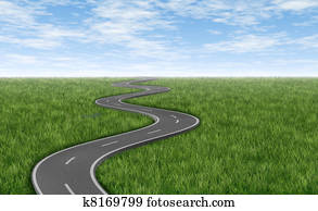 Winding road on green grass horizon