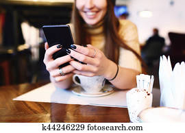 Close up of women's hands holding cell telephone Close up of women's hands holding cell telephone