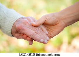 Senior and young holding hands Senior and young holding hands