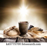 Communion - Unleavened Bread With Chalice Of Wine And Cross Light Communion - Unleavened Bread With Chalice Of Wine And Cross Light