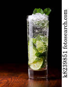 Mojito Cocktail on a wooden table Mojito Cocktail on a wooden table