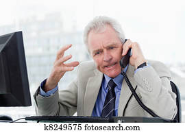 Angry senior manager on the phone Angry senior manager on the phone
