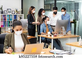 Asian business team working in new normal and social distance office