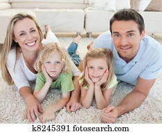 Family lying on the carpet
