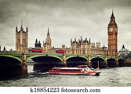 London, the UK. Big Ben, the River Thames, red buses and boat in vintage style