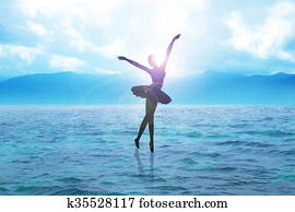 Silhouette illustration of a ballerina dancing on water Silhouette illustration of a ballerina dancing on water