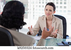 Smiling manager interviewing a male applicant