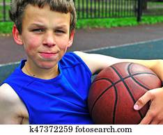 Teenage with a basketball on court Teenage with a basketball on court
