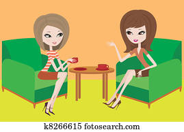 Two young women talk in armchairs