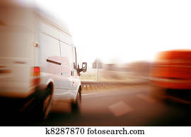 Trucks, delivery vans on freeway Trucks, delivery vans on freeway