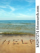 Word HELP on beach sand