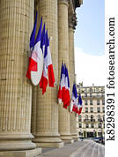 French tricolor flags hang on the Pantheon during the Fete Nationale (Bastille Day) French tricolor flags hang on the Pantheon during the Fete Nationale (Bastille Day)
