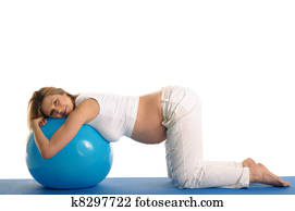 pregnant woman practicing yoga with blue ball