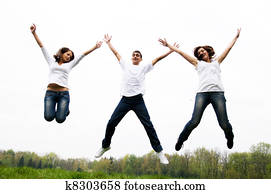 Happy friends jumping