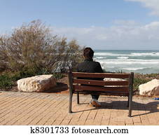 Loneliness.Woman sitting alone on  
