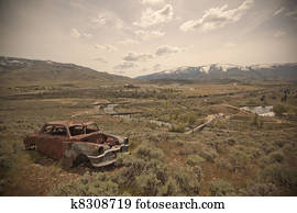 Old abandoned car with bullet holes