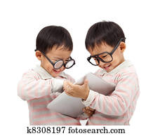 two happy kids using touch pad computer  and isolated on white 