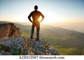 Man on top of mountain