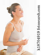 Portrait of happy young woman holding pregnancy test