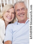 Happy Senior Man & Woman Couple Smiling at Home